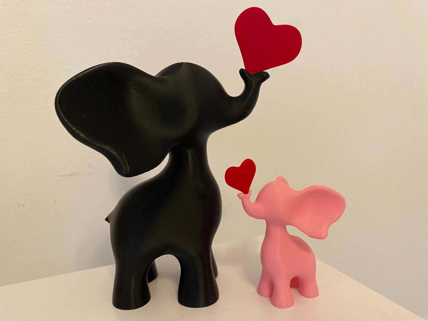 Playful Elephant Heart Sculpture